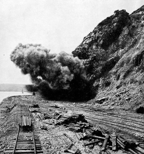 BLASTING THE CLIFFS for the station site at Fishguard