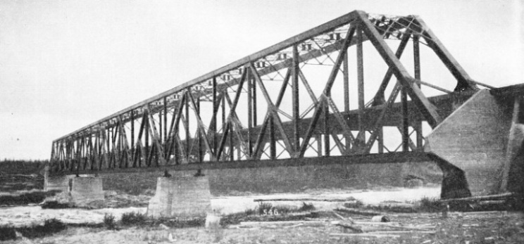 A substantial steel girder structure carries the Hudson Bay Railway across the Nelson River at Kettle Rapids