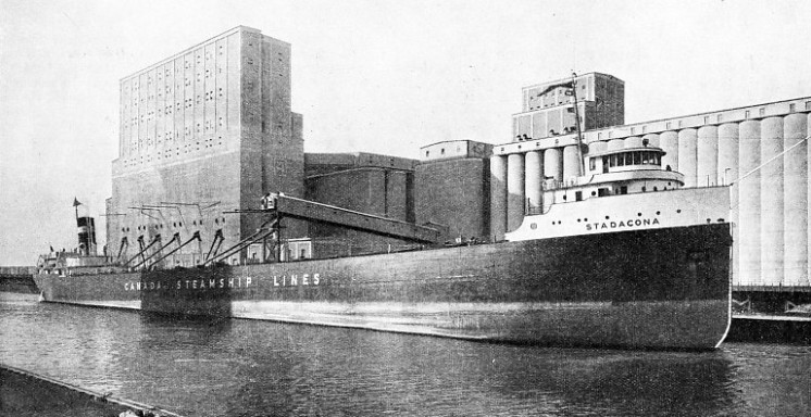 THE GRAIN SHIP Stadacona discharges into elevators at such ports as Fort William and Port Arthur