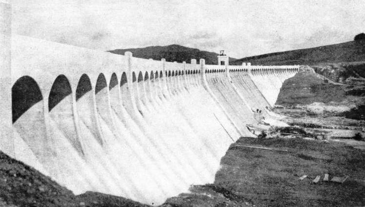 THE DOWNSTREAM FACE of Clatteringshaws Dam