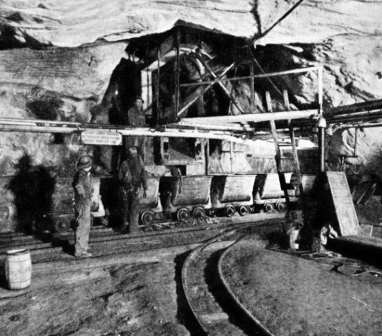 LOADING A TRAIN OF CARS at the McIntyre Porcupine Mines