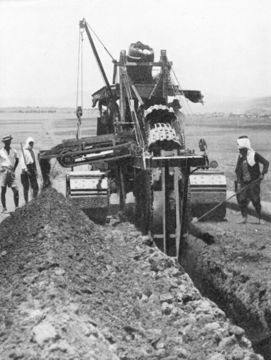 A DITCHING MACHINE AT WORK on the Iraq pipe line