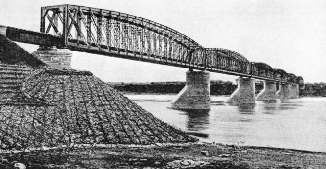 SIX STEEL SPANS carry the Trans-Siberian Railway across the River Tom